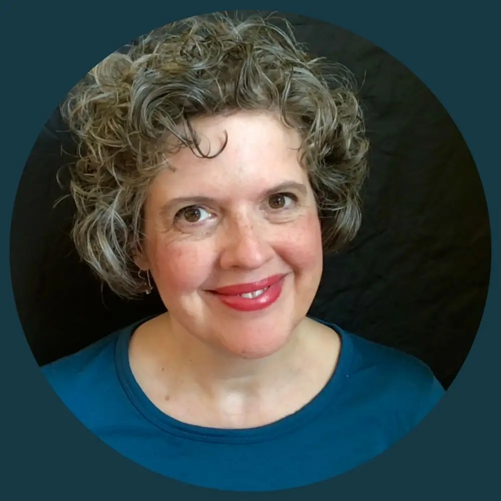 Woman with curly hair smiling